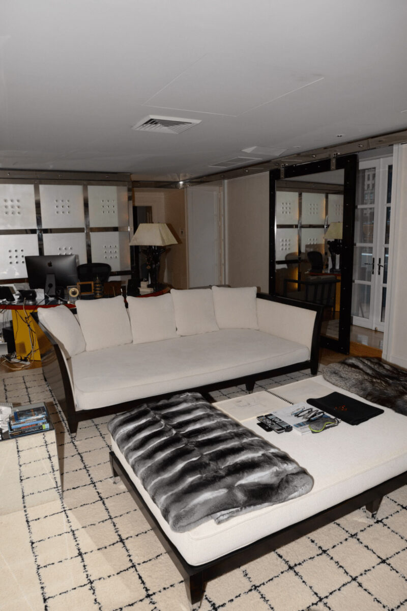 Cozy living room sofa with wooden coffee table and TV unit