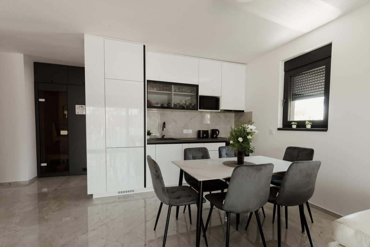 Bright dining area with wooden table and simple chairs