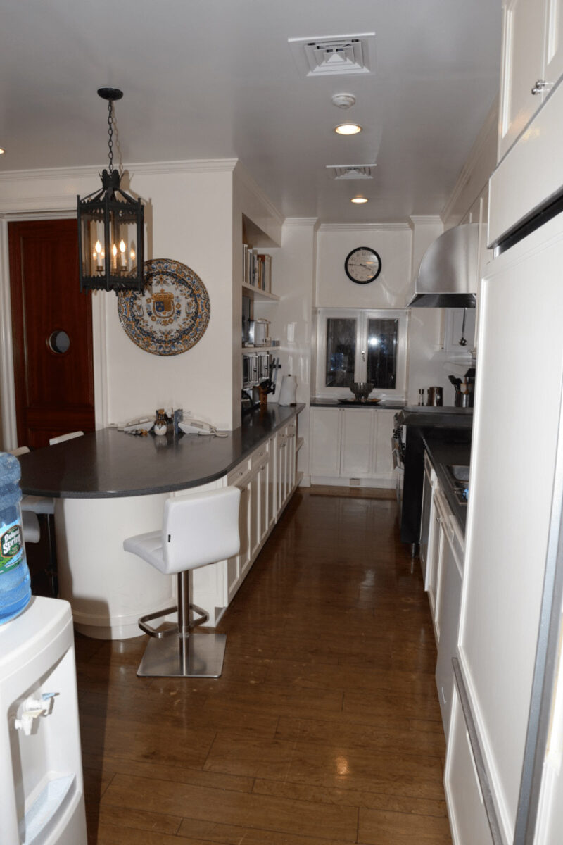Modern kitchen with bar seating and pendant light
