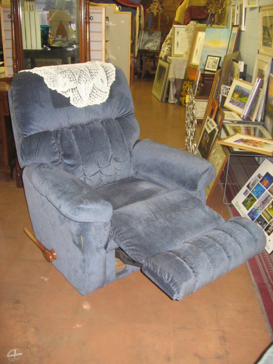 Upholstered recliner armchair
